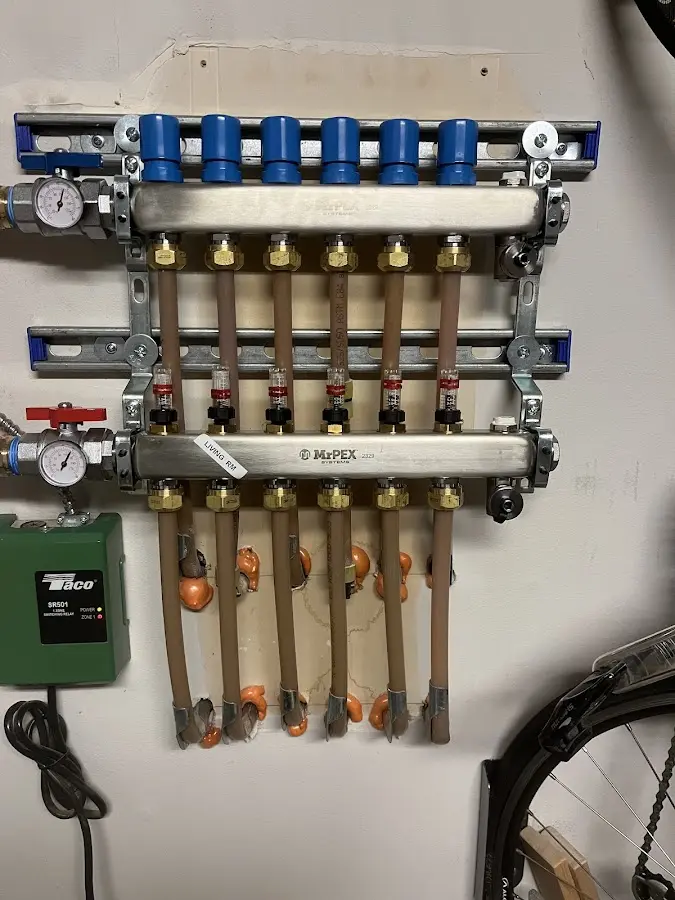 Plumber performing Gas Line Installation at a residential property in Mason City